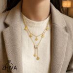 گردنبند پروانه‌های زرین ژیوا از جنس استیل با طراحی چندلایه، پروانه‌های طلایی و آویز پروانه نگین‌دار