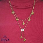 گردنبند پروانه‌های زرین ژیوا از جنس استیل با طراحی چندلایه، پروانه‌های طلایی و آویز پروانه نگین‌دار